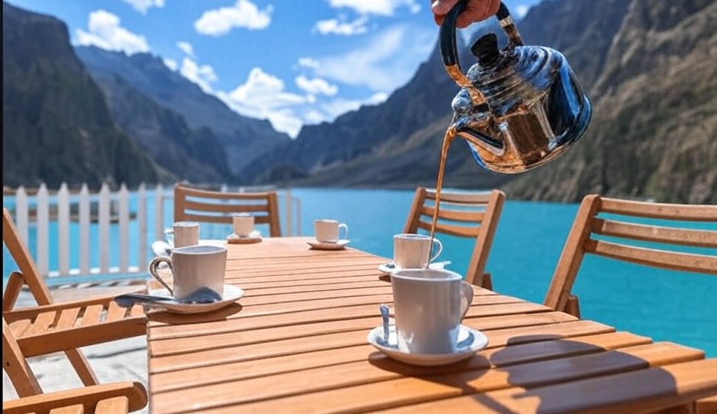 "Tea being served at Luxus Hunza with scenic view of Attabad Lake and surrounding mountains"